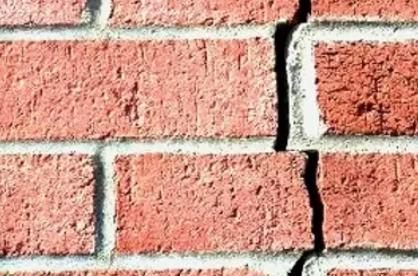 Cracked brickwork requiring urgent repair on new build property